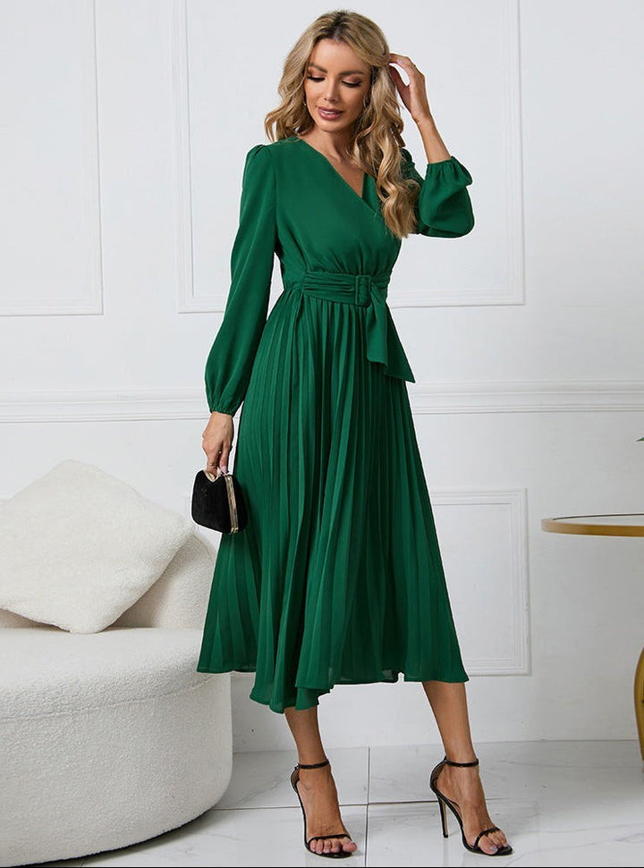 Green pleated wrap dress with belted waist and long lantern sleeves