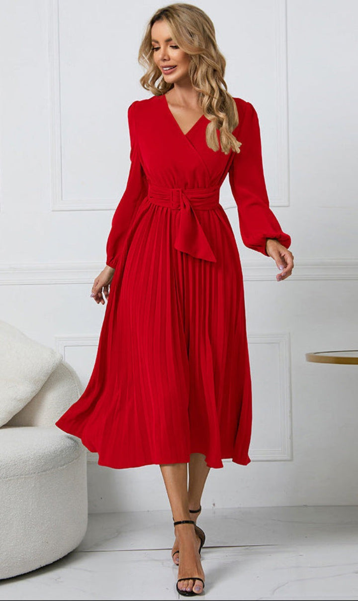 Red belted V-neck midi dress featuring pleated skirt and long sleeves
