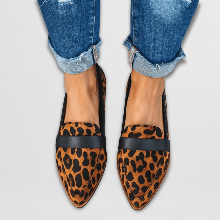 leopard-print suede loafers with black trim, worn with cuffed jeans
