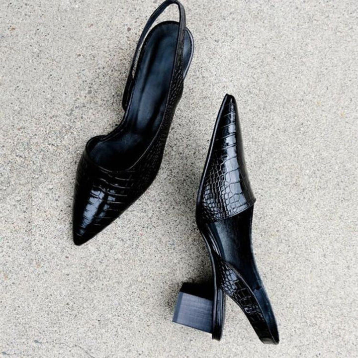 black croc-embossed slingback pumps with pointed toe, top-down view