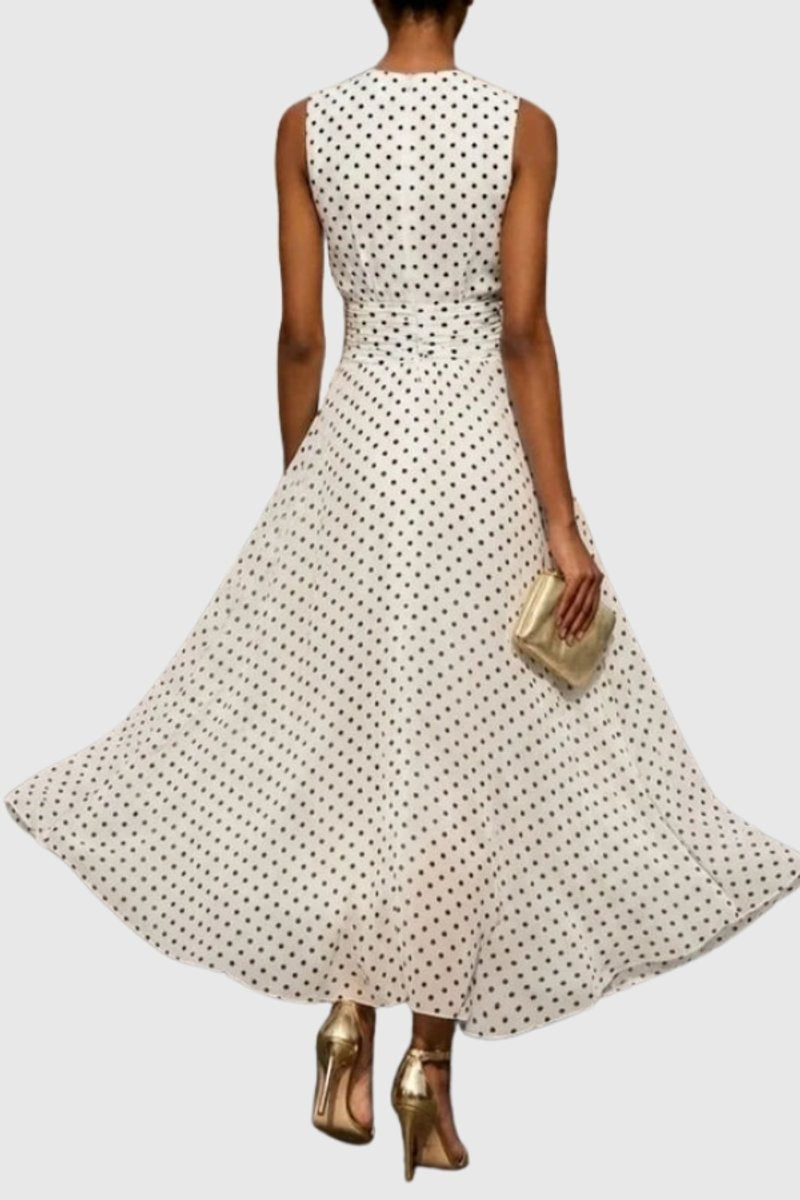 Back view of white polka dot maxi dress with cinched waist