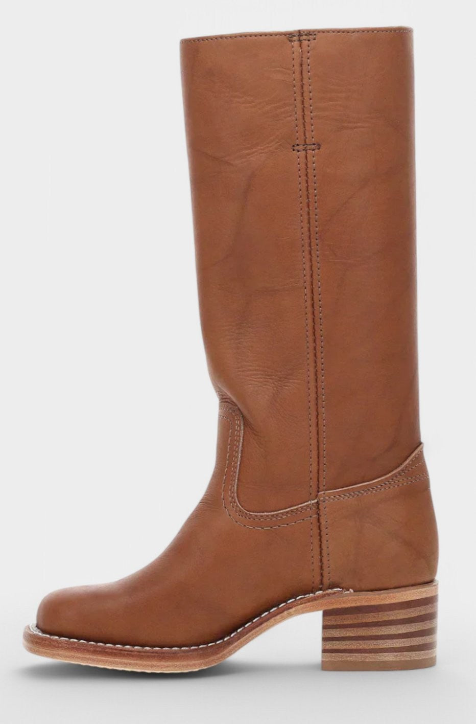 Side profile of tan leather knee-high boot with stacked block heel