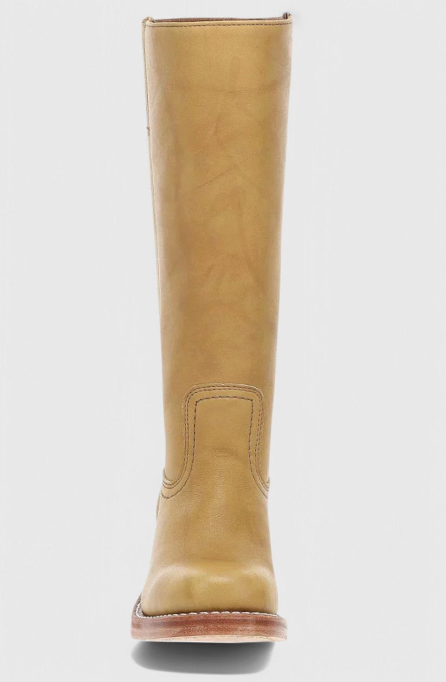 Side profile of camel leather knee-high boot with stacked heel