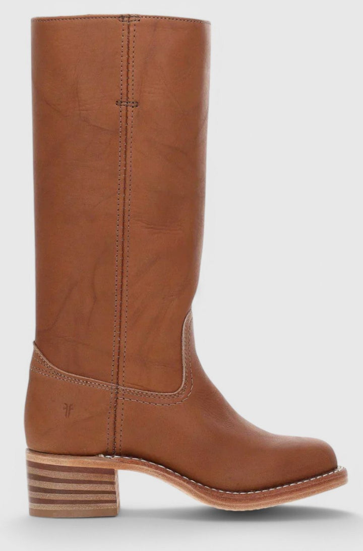Side view of cognac leather knee-high boot with stacked wooden heel