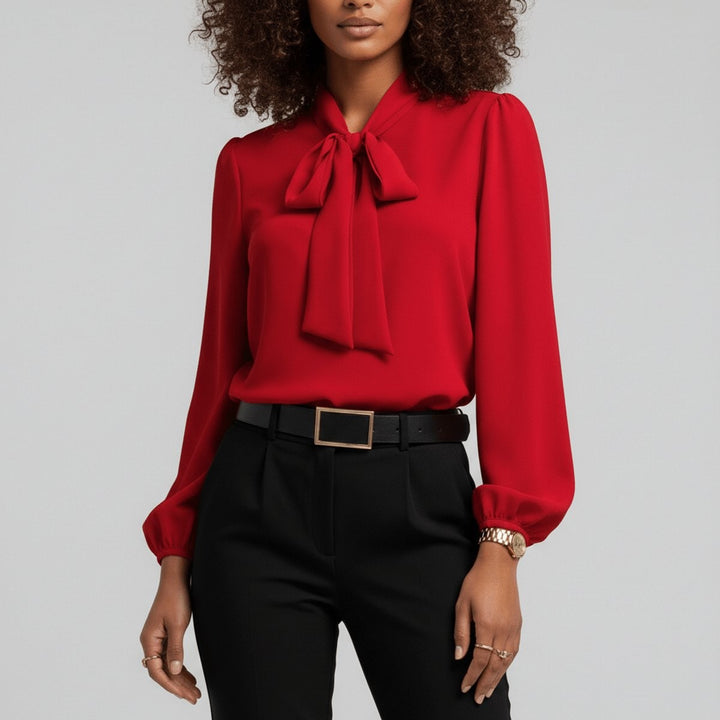 red bow-tie neck blouse with balloon sleeves and black tailored pants