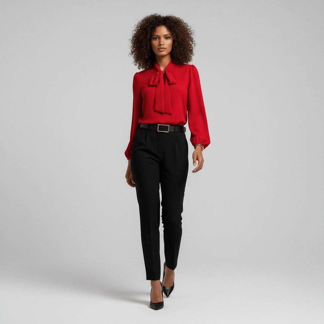 full-length view of red bow-tie blouse styled with black trousers and heels