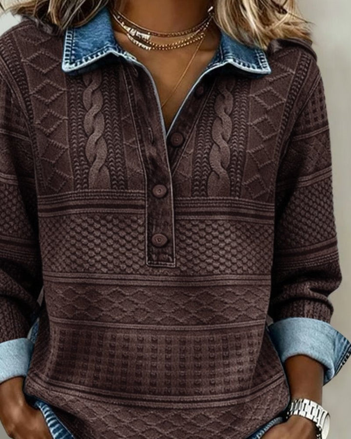 Close-up of brown cable-knit sweater with wooden button placket