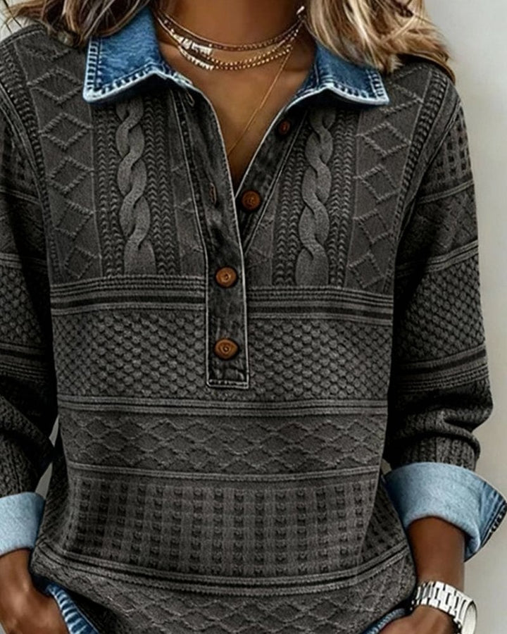 Charcoal cable-knit sweater with denim collar, close-up button detail