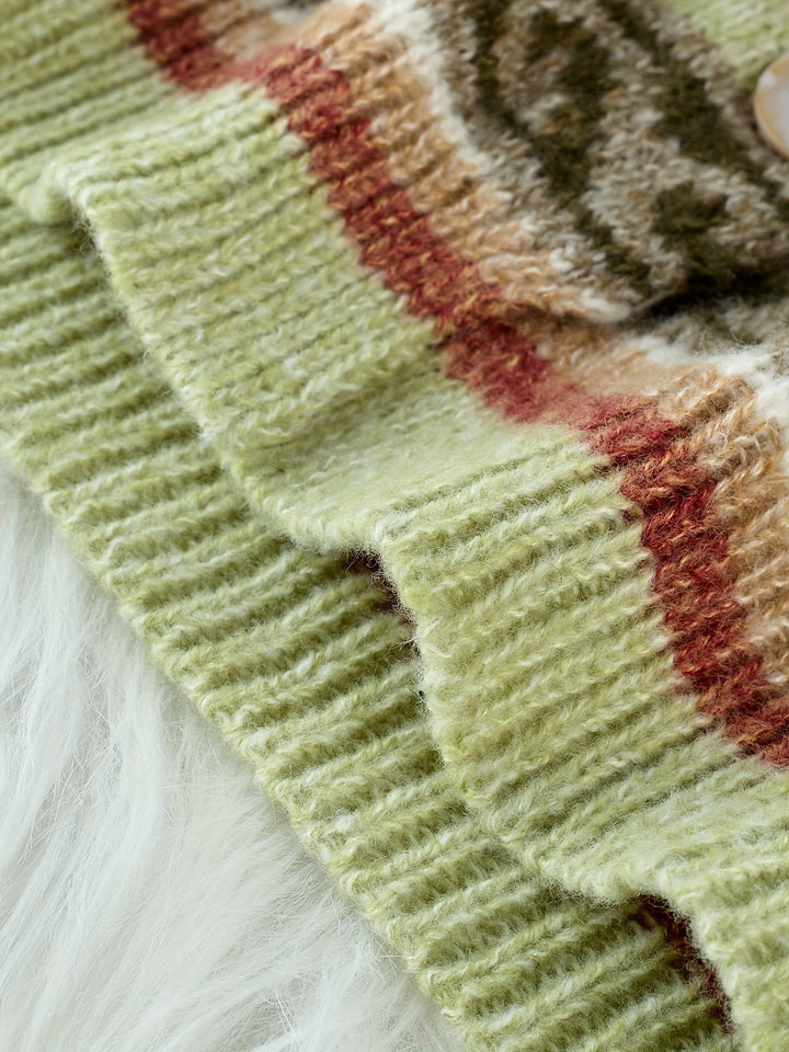 Close-up of ribbed cuff texture on sage green knit cardigan