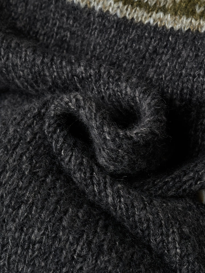 Close-up of ribbed knit texture on black cardigan sleeve