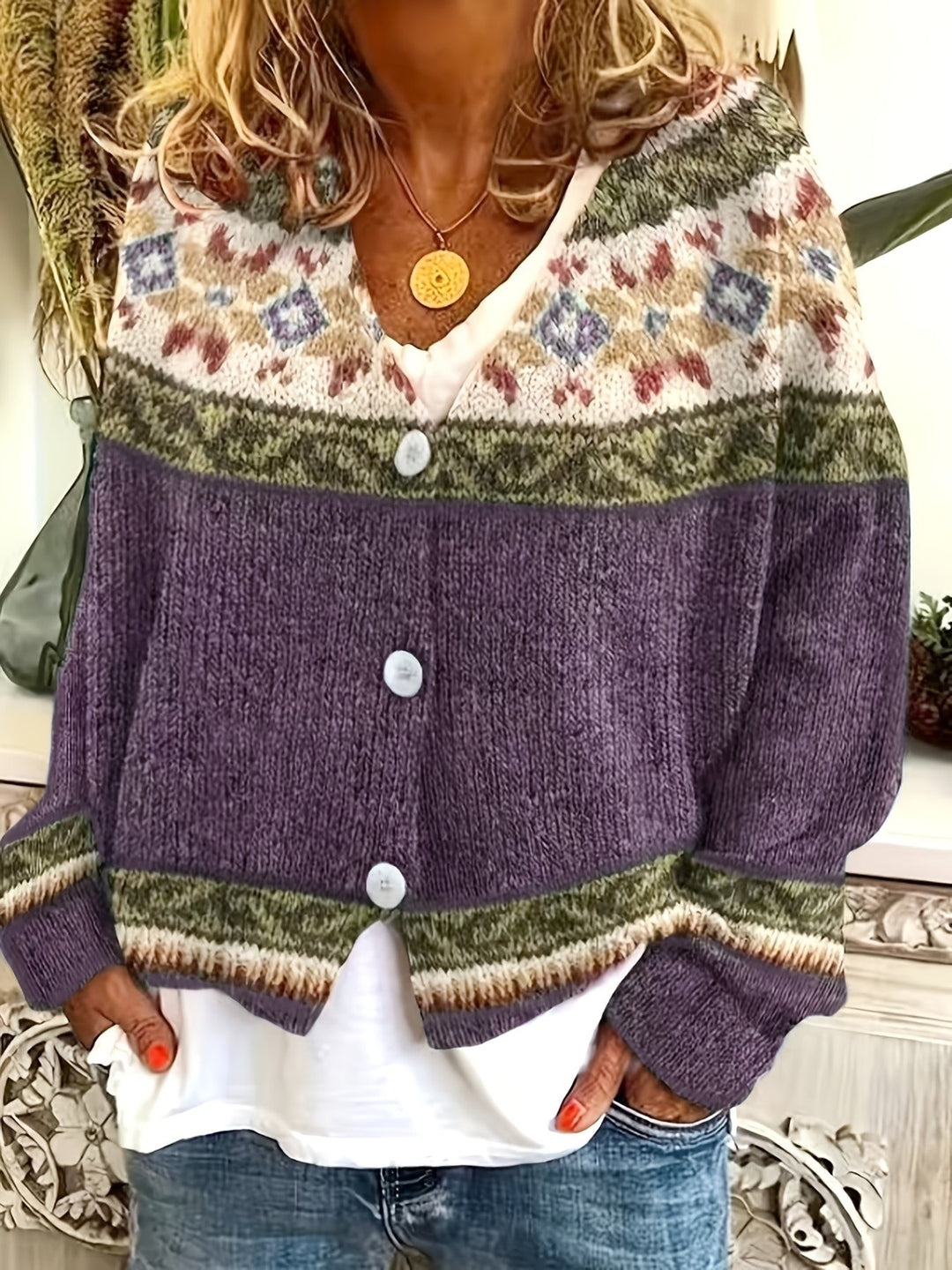Close-up of ribbed cuff and Fair Isle pattern on purple cardigan