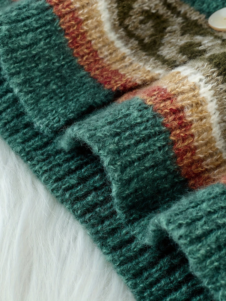Close-up of ribbed cuff and Fair Isle pattern on green knit cardigan
