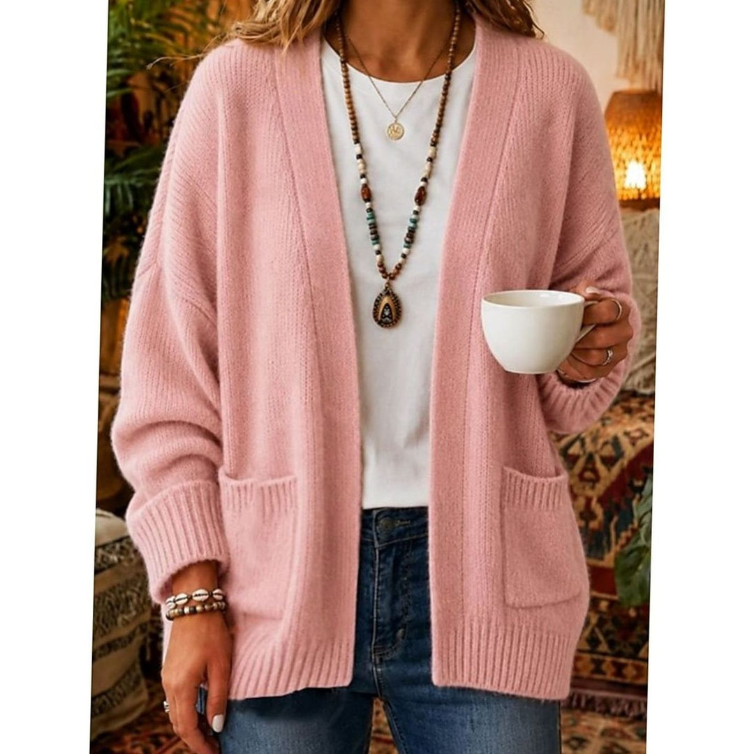 Blush pink open-front knit cardigan with pockets styled over white top