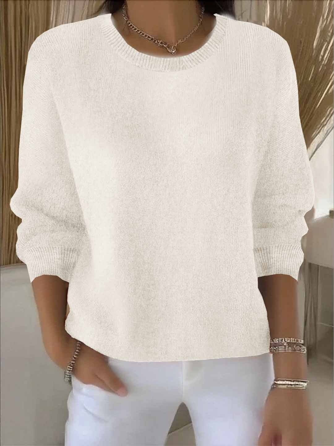 Ivory knit sweater with ribbed trim and oversized batwing sleeves