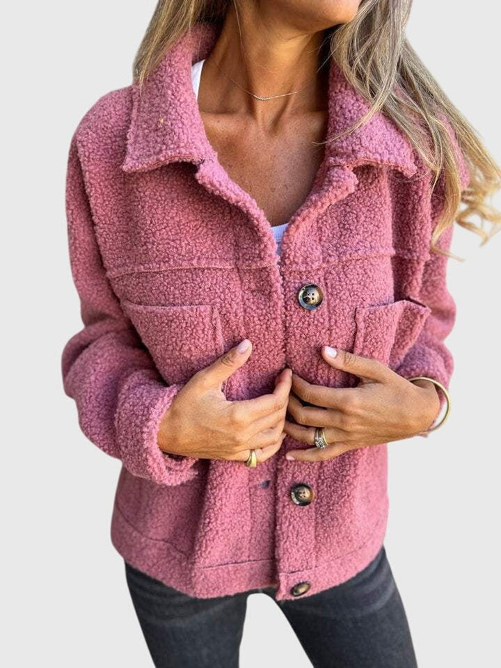 Dusty pink sherpa fleece jacket with front pockets and button closure