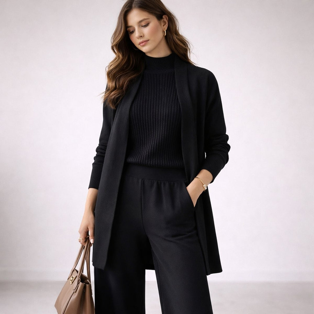 Black three-piece knit lounge set with ribbed sweater and matching wide-leg pants