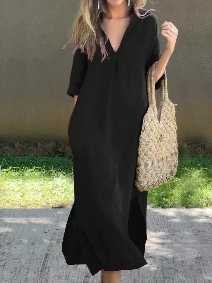 Black V-neck linen maxi dress featuring relaxed fit and half sleeves
