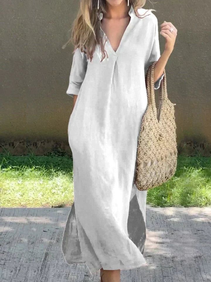 White V-neck linen maxi dress with relaxed silhouette and side slit