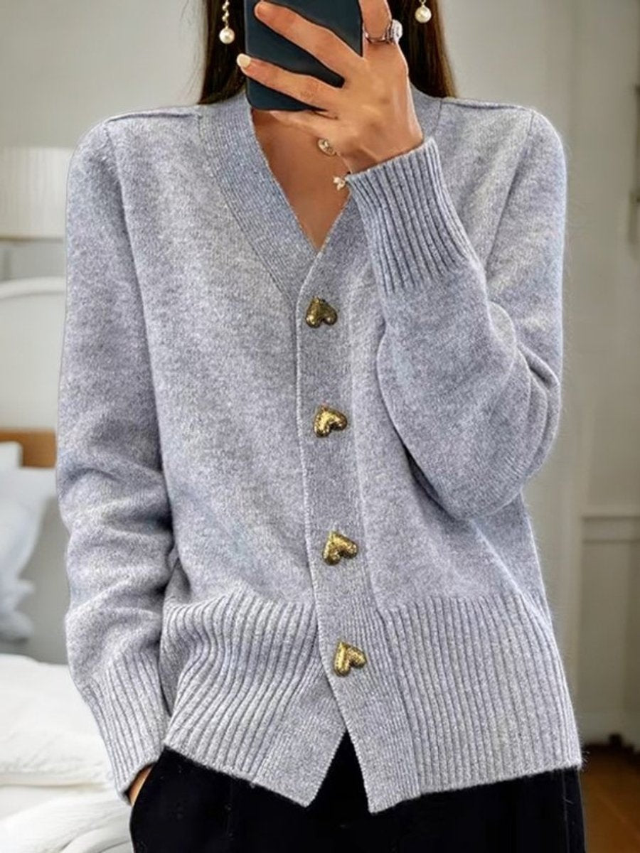 Heather gray V-neck cardigan featuring ribbed cuffs and heart buttons