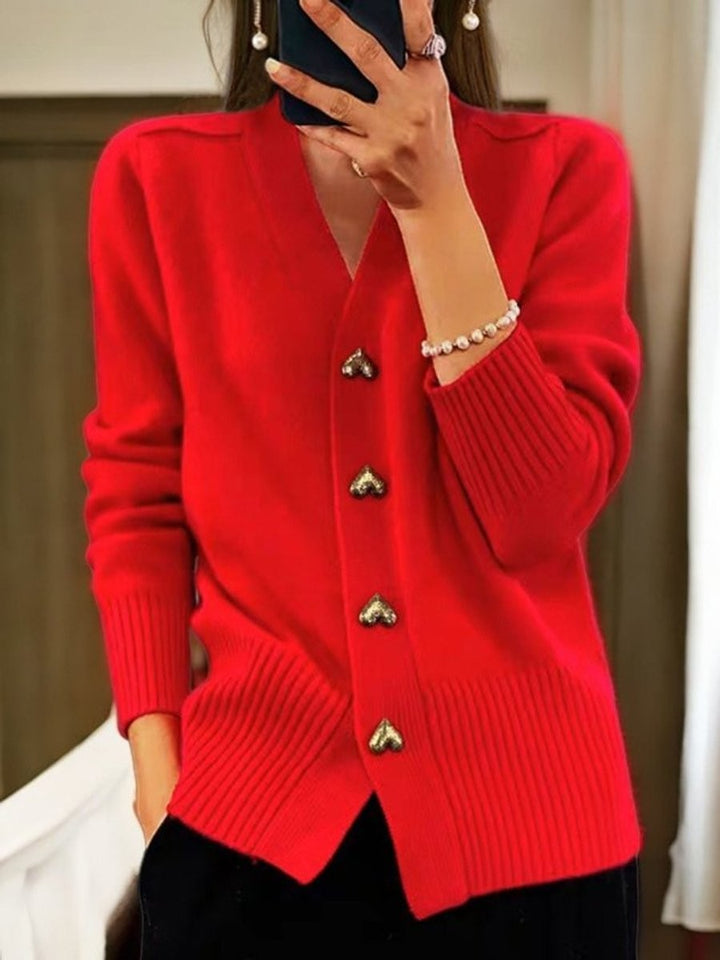 Red V-neck cardigan sweater with ribbed hem and heart-shaped buttons