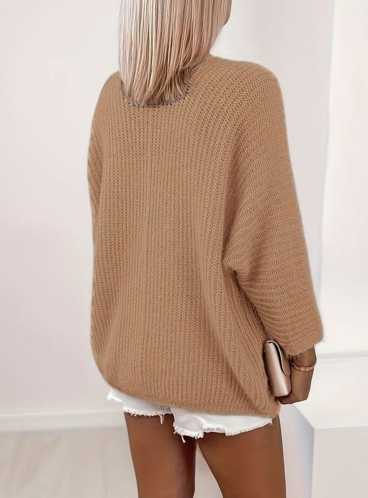 back view of camel brown oversized knit cardigan with dolman sleeves