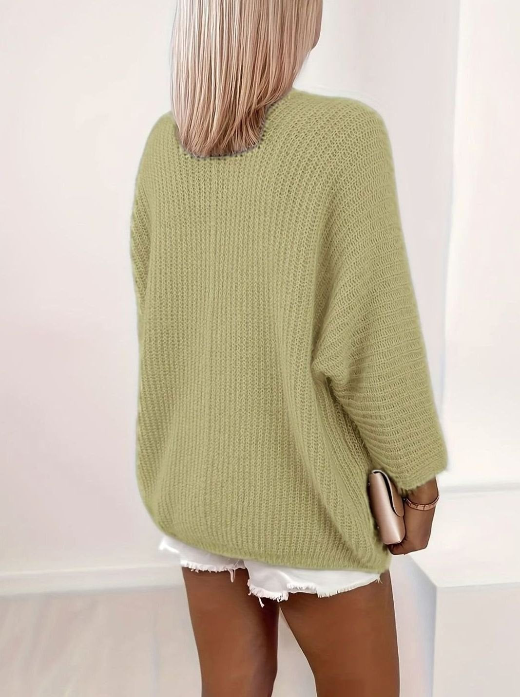 back view of sage green oversized knit cardigan with relaxed fit