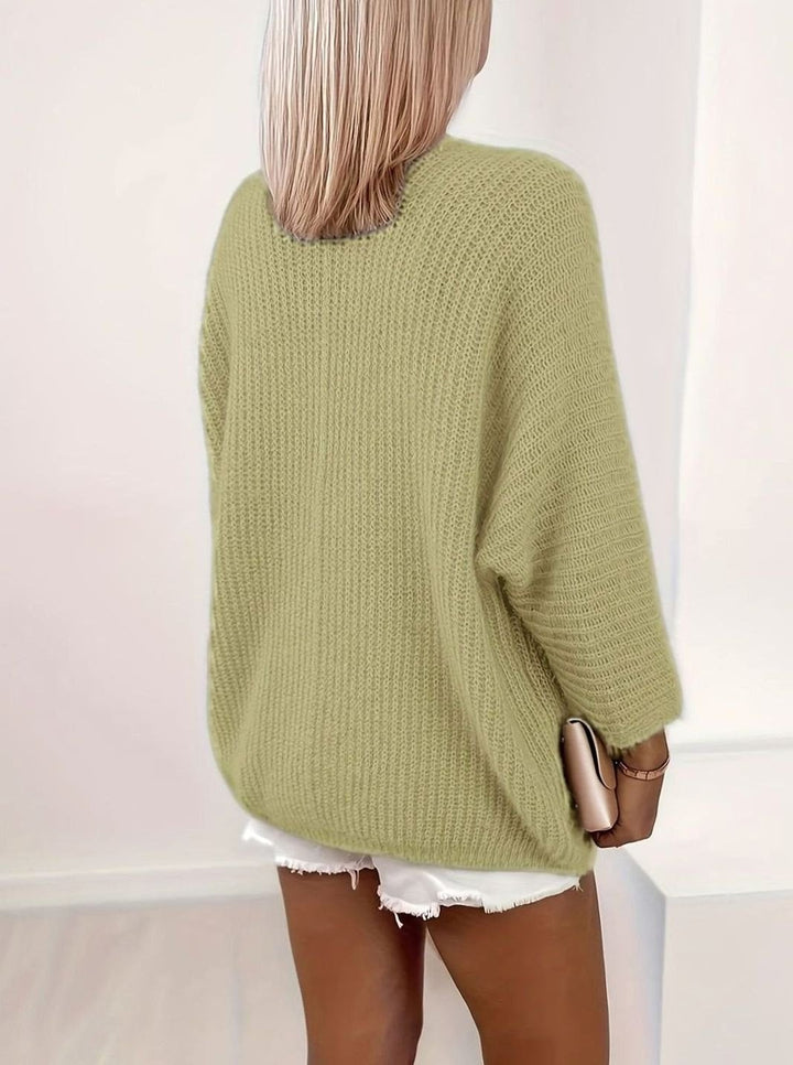 back view of sage green oversized knit cardigan with relaxed fit