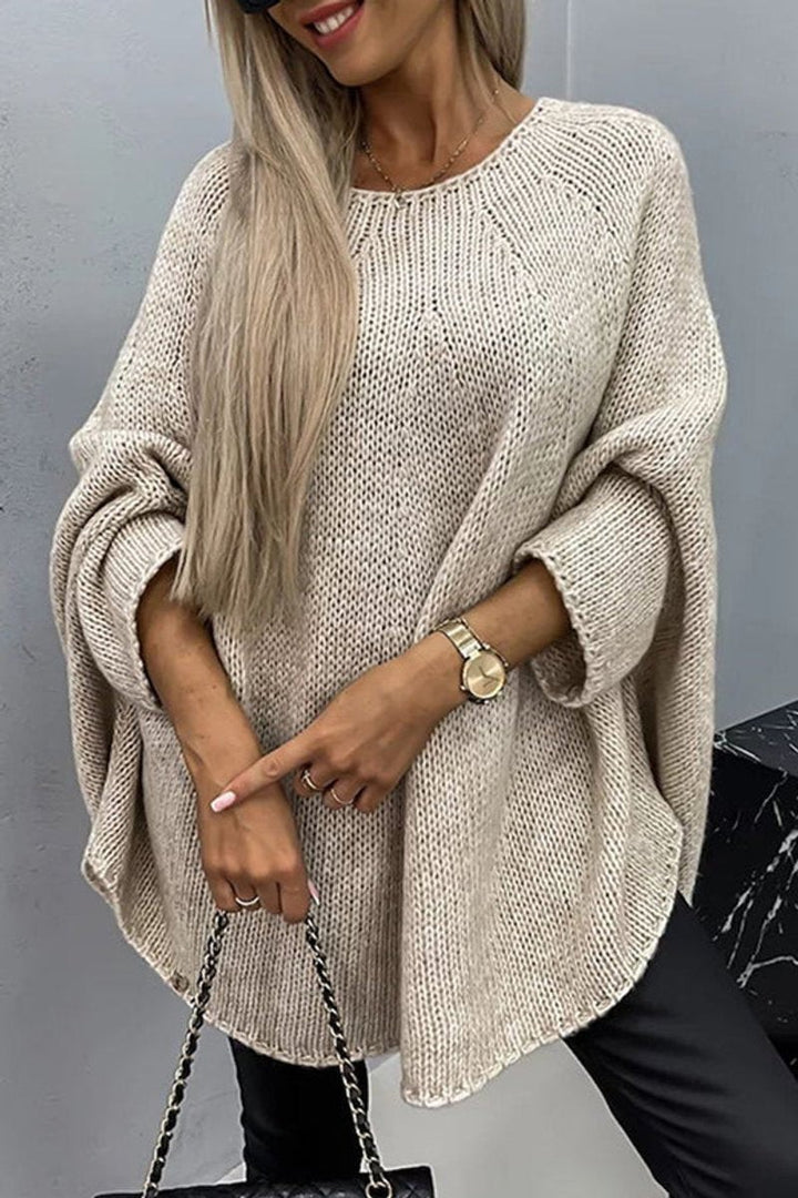 Beige oversized knit sweater with batwing sleeves and round neckline