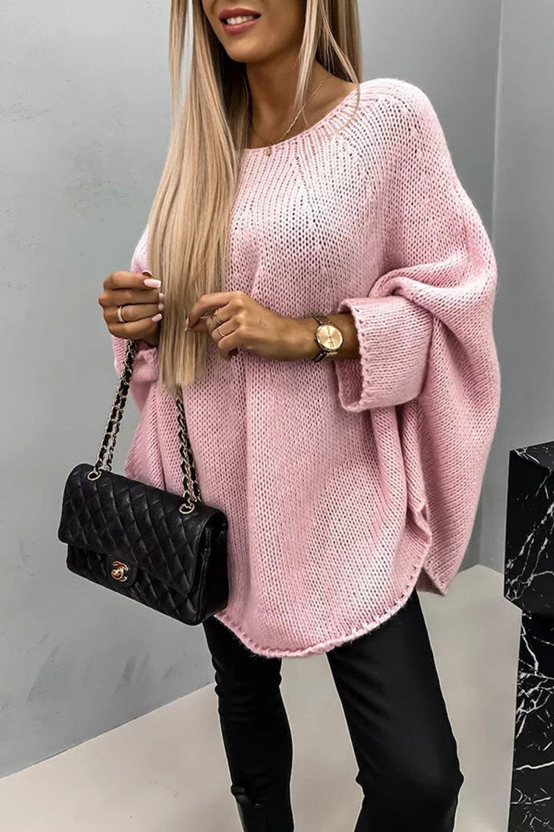 Pink oversized knit sweater with dropped shoulders and ribbed cuffs