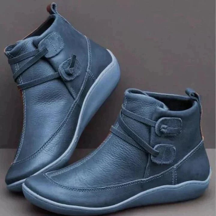 Blue-gray leather ankle boots with buckle strap and rounded toe