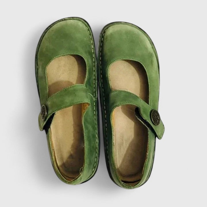 Top view of green leather Mary Jane orthopedic shoes with button strap