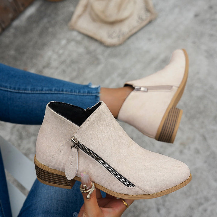 beige suede ankle boots with side zipper and stacked block heel