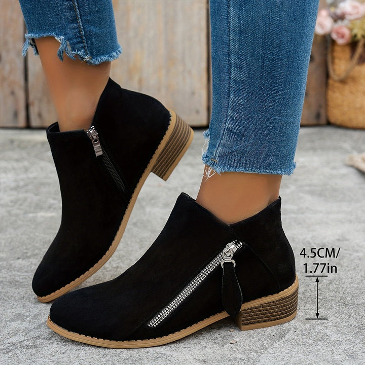 black suede ankle boot shown with 1.77 inch stacked heel measurement