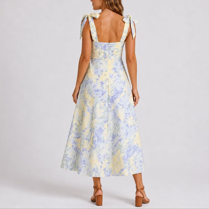 Back view of pastel floral midi dress showing tie straps and open back