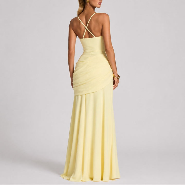 back view of pale yellow maxi gown showing crisscross strap detail