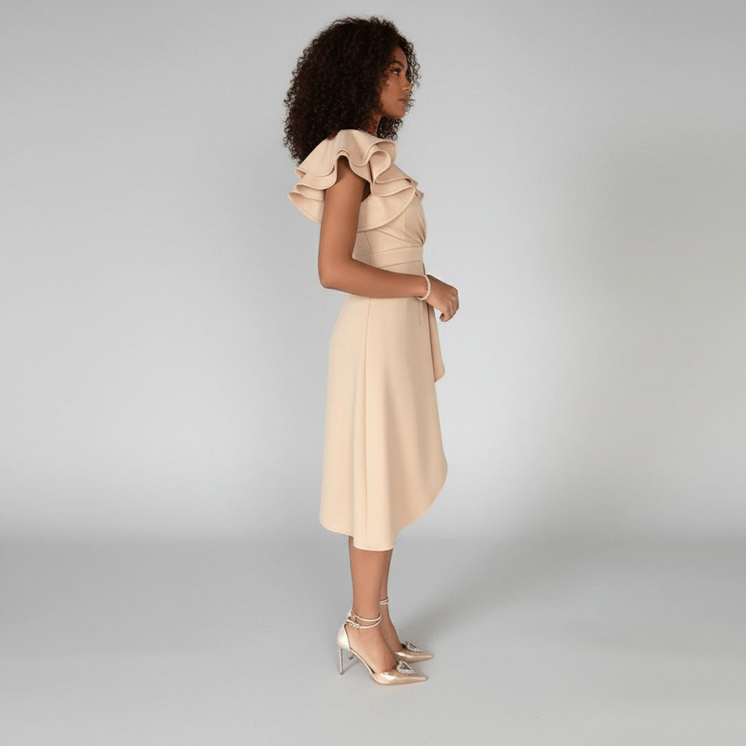 Side view of beige wrap midi dress with ruffled cap sleeves and flowing skirt