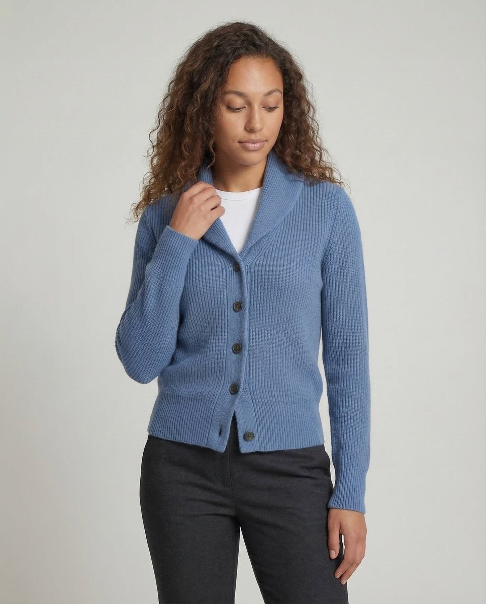 Model wearing blue ribbed cardigan with shawl lapel and button front