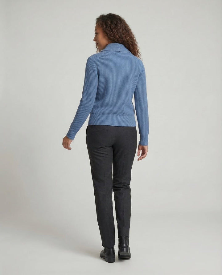 Back view of blue ribbed cardigan showing cropped fit and collar