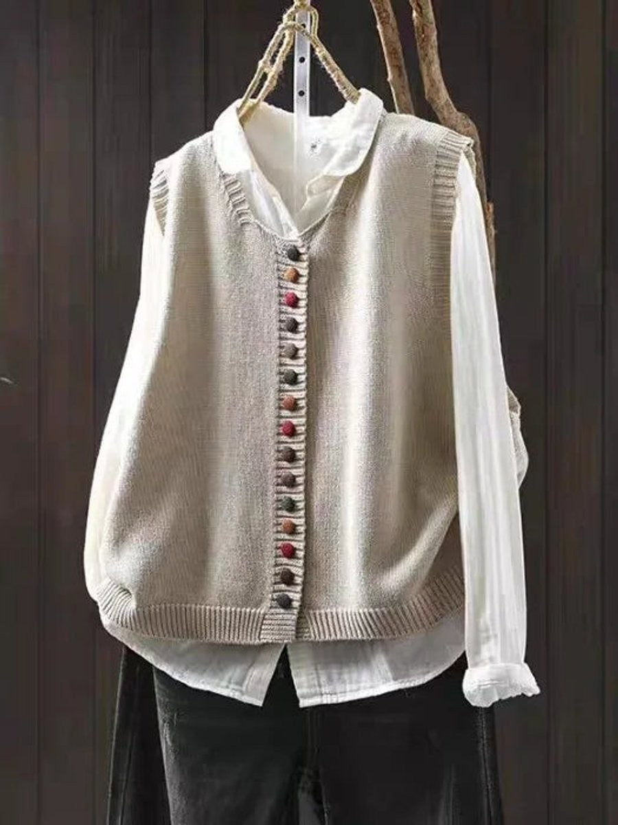 beige knit sleeveless vest with colorful button placket and ribbed trim