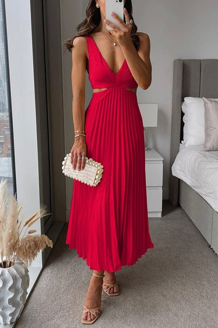 Red pleated maxi dress showing V-neck and waist cutout design