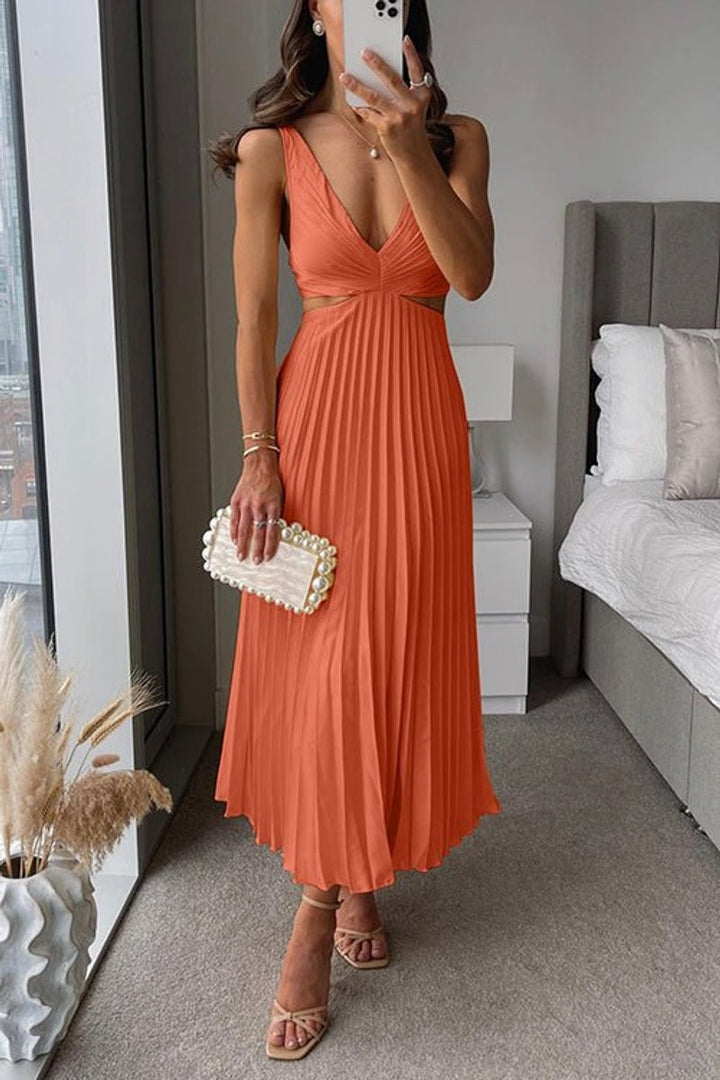 Orange pleated maxi dress featuring V-neck and side waist cutouts