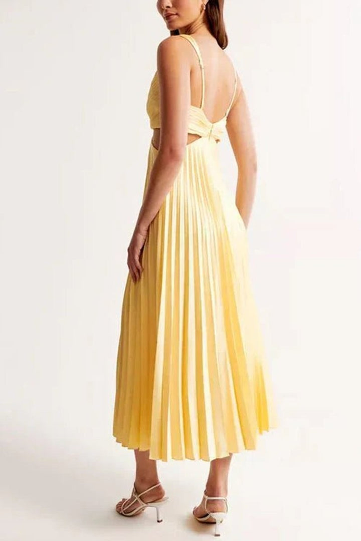 Back view of pale yellow pleated maxi dress with cutout waist