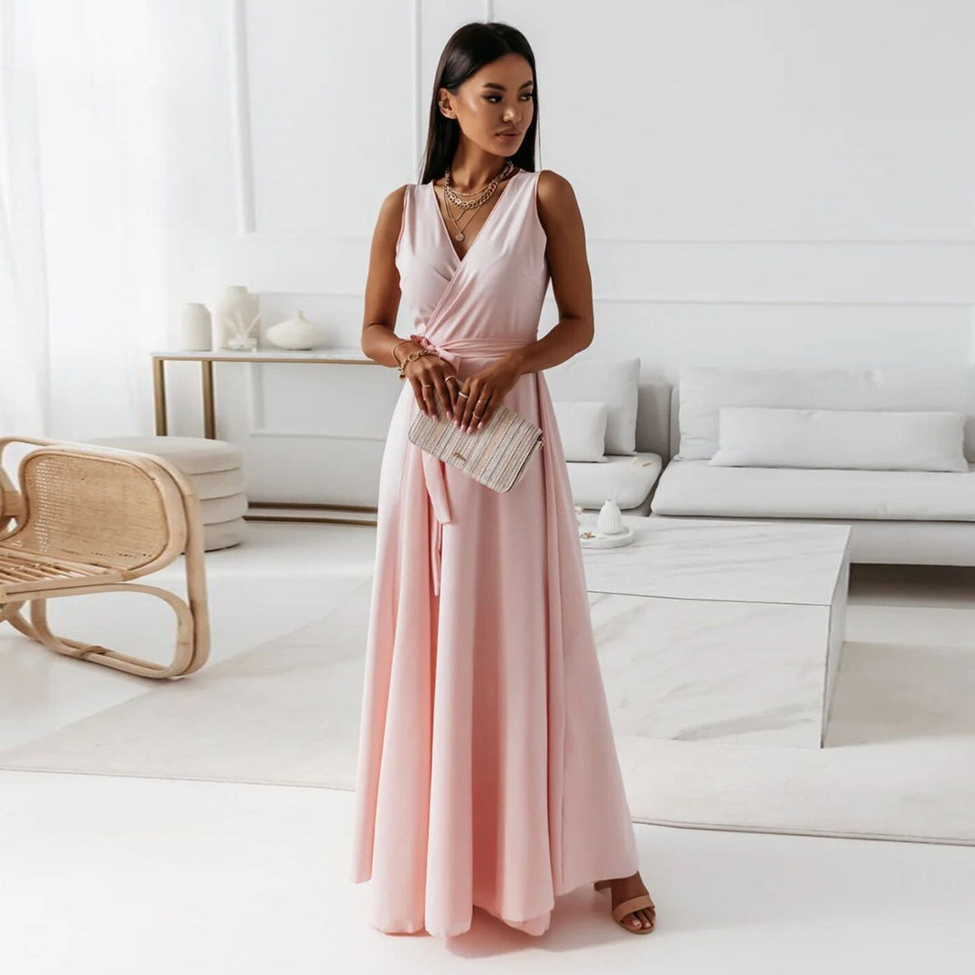 Blush pink wrap maxi dress with V-neck and sleeveless flowy silhouette