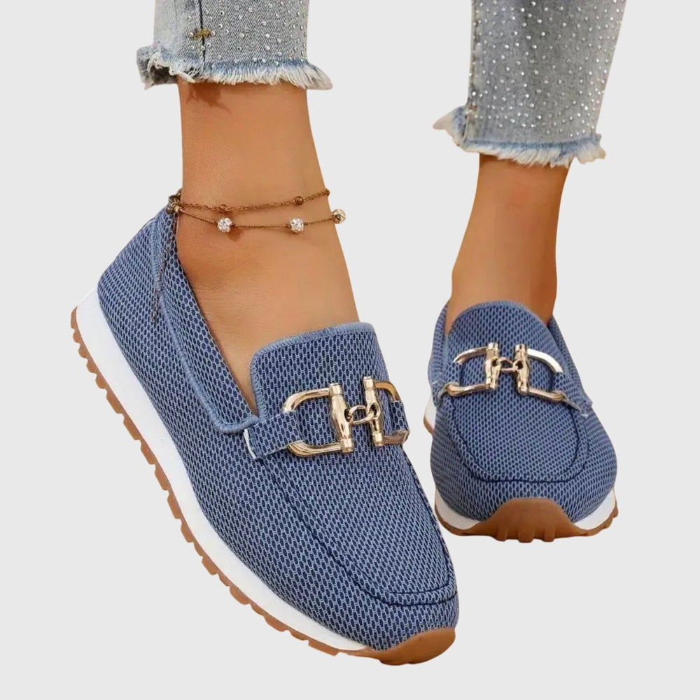 Blue mesh knit slip-on loafers featuring gold buckle detail and cushioned sole