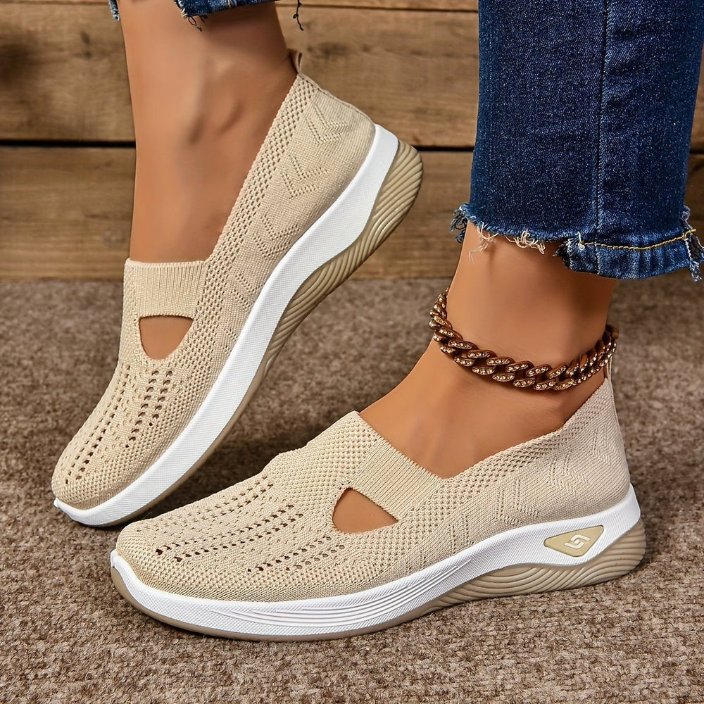 Beige mesh slip-on sneakers featuring cutout design and chunky sole