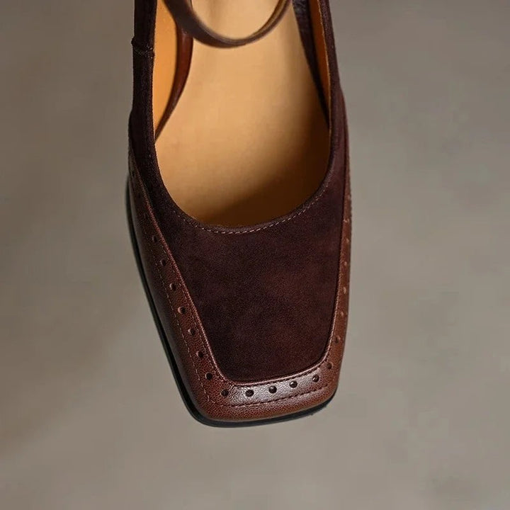 top view of brown suede toe cap with perforated brogue trim