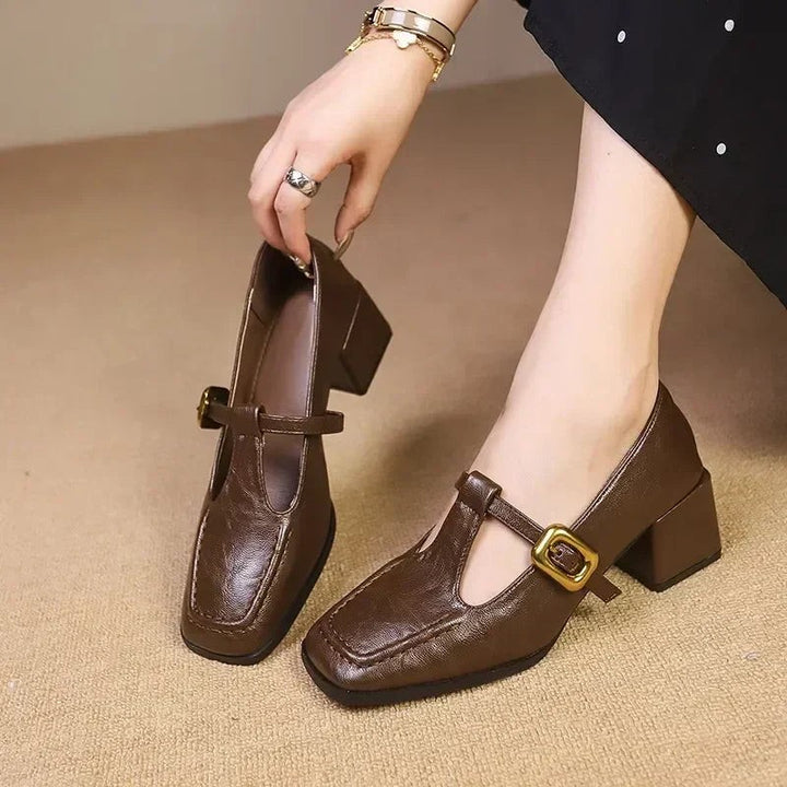 Brown leather Mary Jane heels with square toe and gold buckle strap