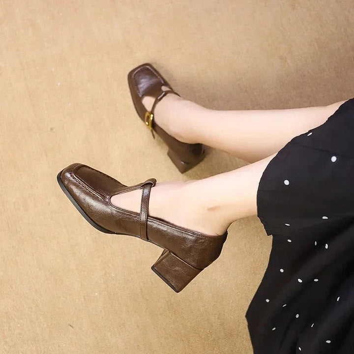 Square toe block heel Mary Janes shown from above in brown leather