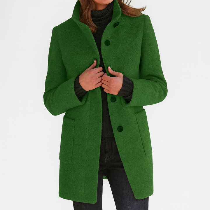 green wool-blend coat with stand collar over black turtleneck