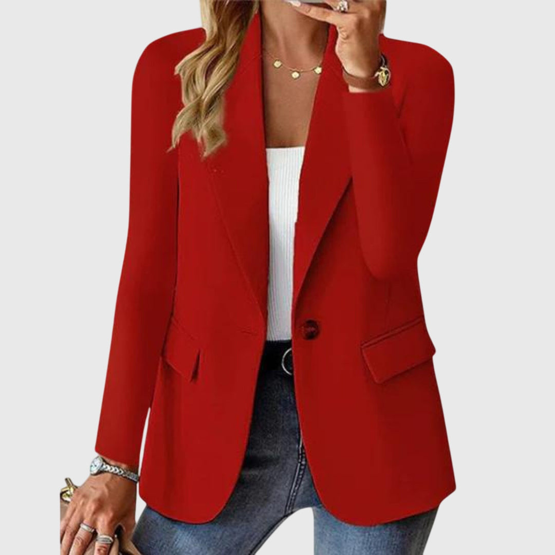 Red single-button blazer with notched lapel styled over a white tank top